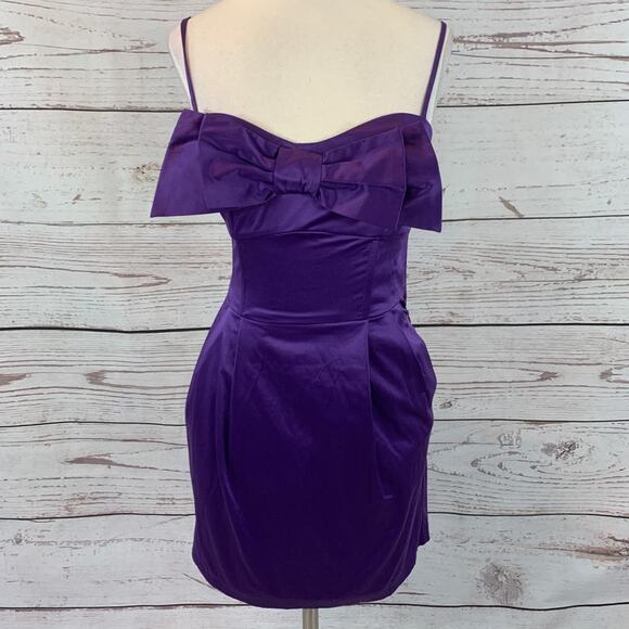 Wet Seal Dresses & Skirts - Wet Seal purple mini dress front bow front pockets